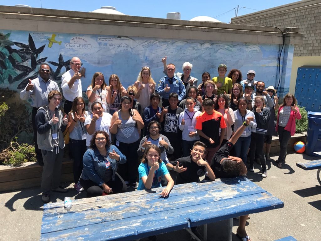 Group of students with YFIOB volunteers