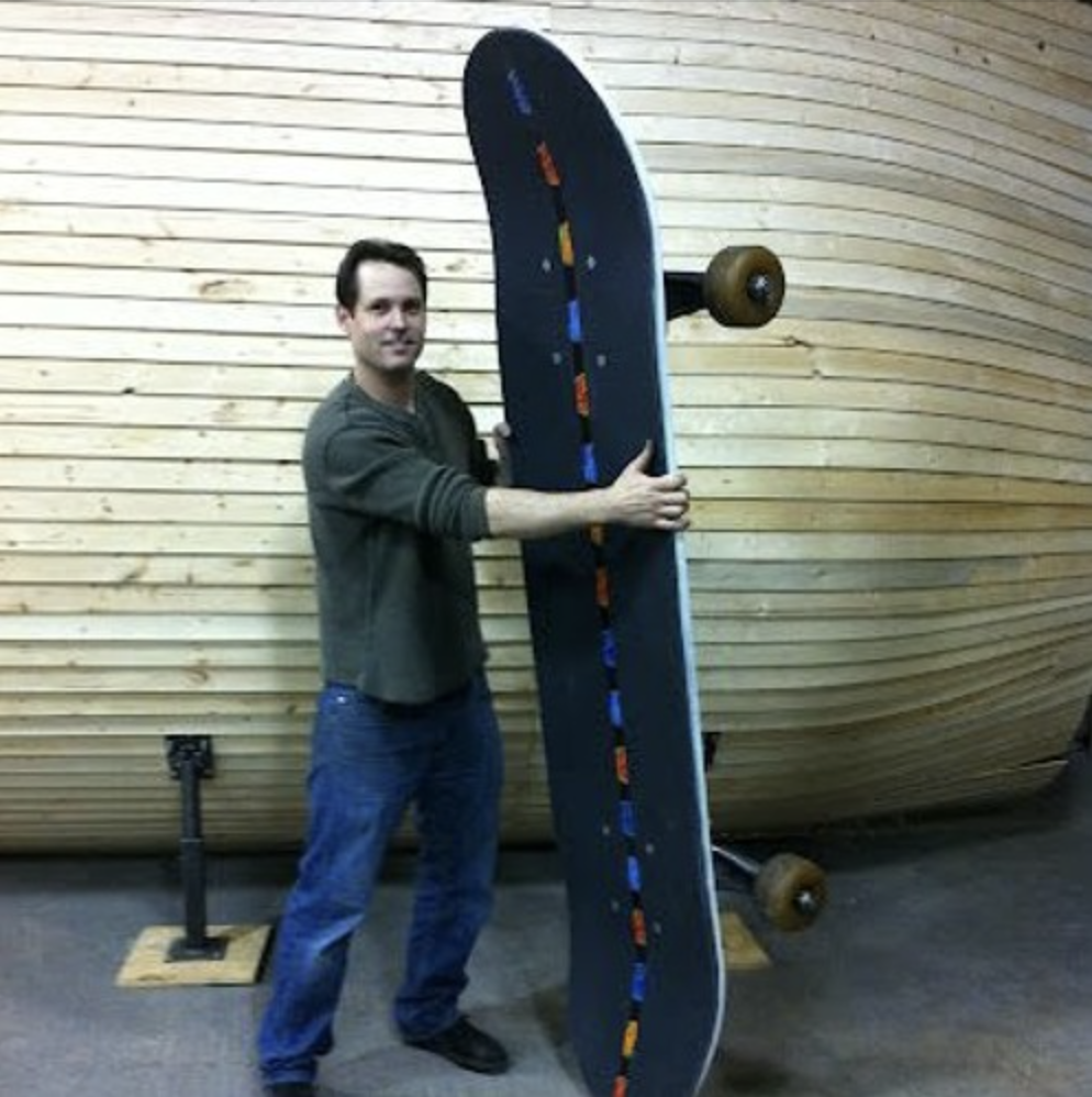 Payson McNett with giant skateboard