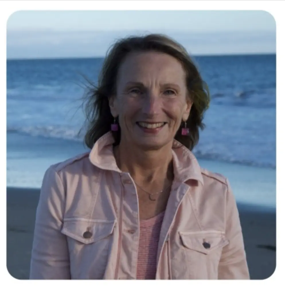 Katherine O'Dea wearing pink jacket at ocean